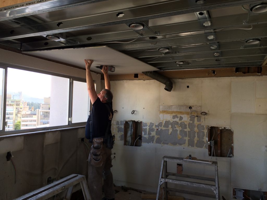 Denis is finishing drywalling